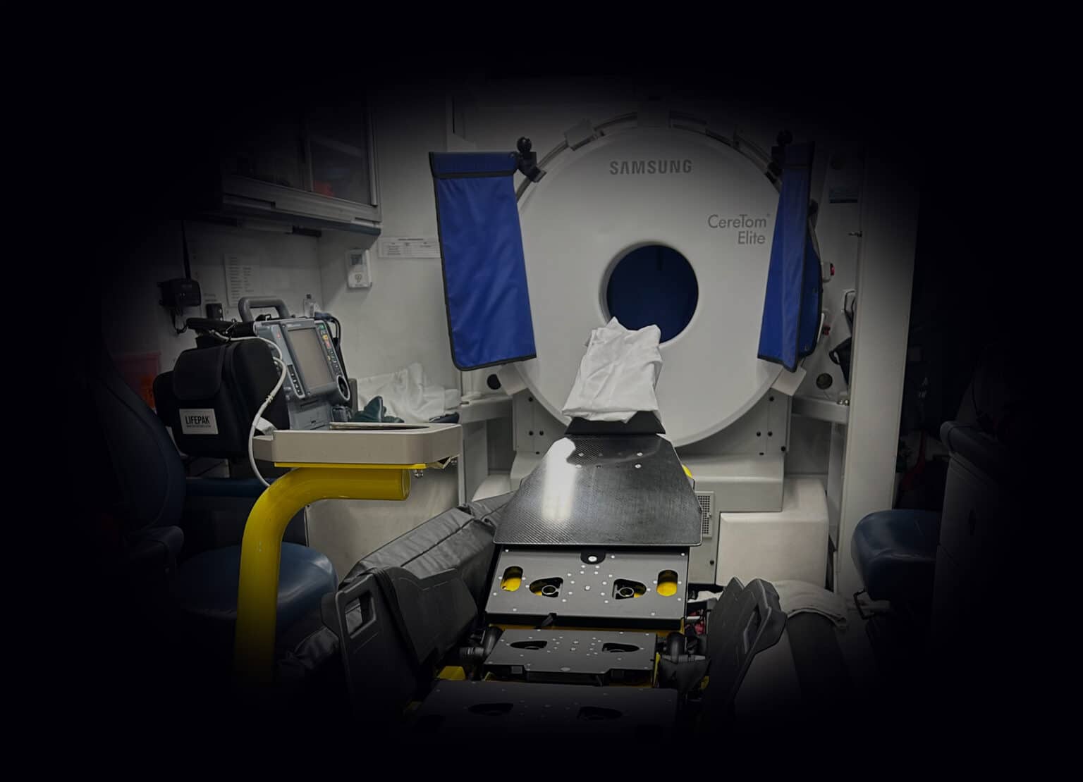 OneWeight cot scale on a mobile stroke treatment unit cot next to the CT scanner